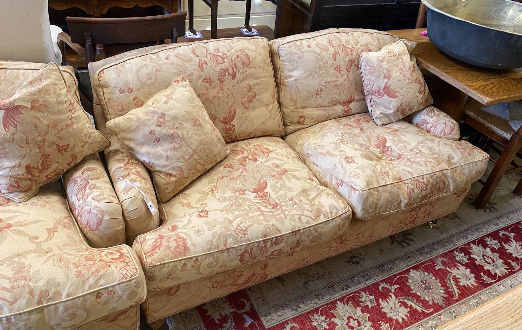 A pair of John Sankey two seater settees with feather cushion seats and backs, length 156cm, depth 82cm, height 75cm